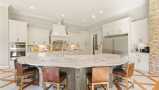 A Large Kitchen Island Adds Extra Seating & Countertop Space