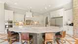 A Large Kitchen Island Adds Extra Seating & Countertop Space